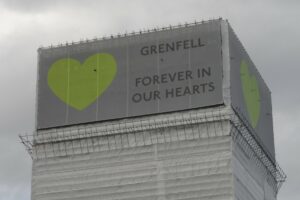 Close up of grenfell tower with banners in june 2018