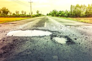 puddles-on-the-road-when-it-rains-potholes-on-the-highway-rsz-300x200.jpg