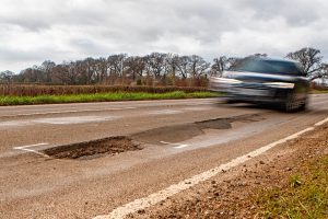 road-highway-crack-pothole-damage-300x200.jpg