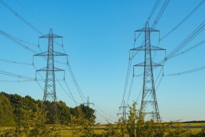 A stock photo of high voltage overhead transmission lines in the UK