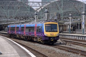 train-leaving-Manchester_Piccadilly_station_-300x200.jpg