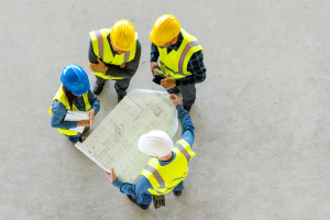 cement-workers-plans-hard-hats-construction-2-300x200.png